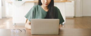 Photo of a woman using a laptop. Struggling to find the time to manage your anxiety symptoms? With online anxiety therapy in California you can begin coping with your anxiety symptoms. Click here to learn more!